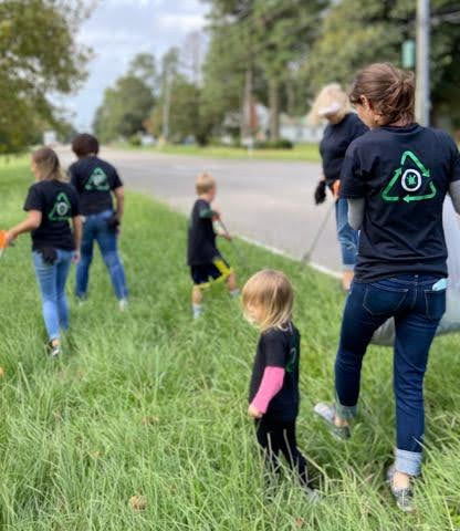 Photo of Christenson Family Orthodontics staff cleaning up a roadside